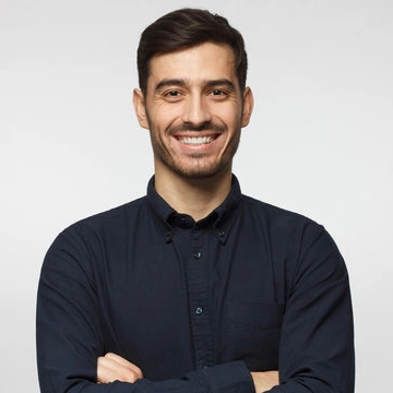 Smiling man in a dark shirt with crossed arms