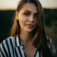 Woman in a striped shirt outdoors